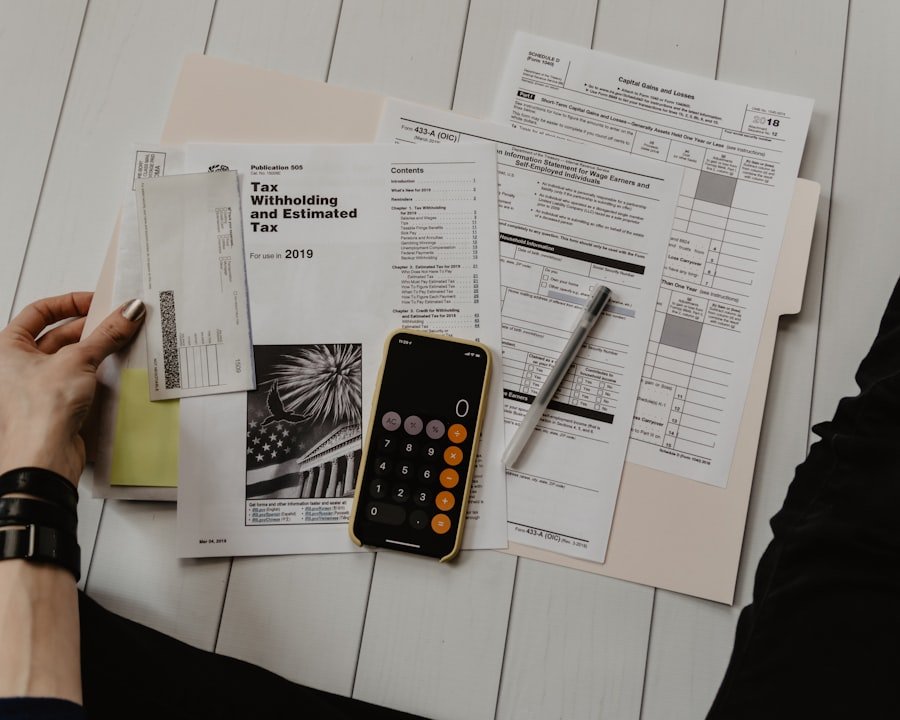 Accountant reviewing financial documents with a calculator